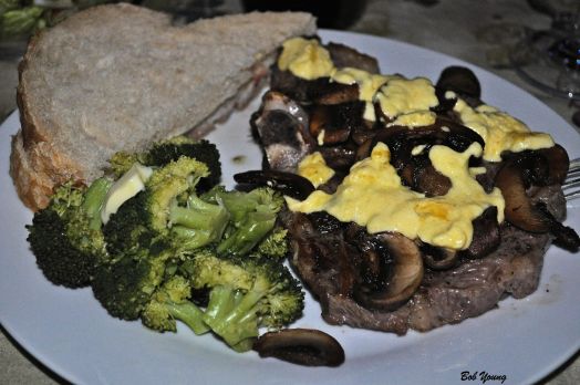 Rib-Eye Steak with Grilled Mushrooms and Hollandaise Sauce Buttered Steamed Broccoli Acme Bake Shop Sourdough Bread