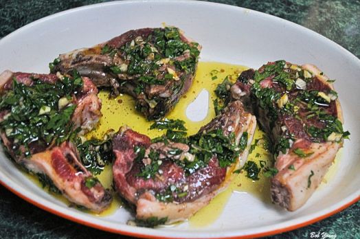 4 med laqmb chops, 1/4 c Olive Oil, Salt and Pepper to rare, 1/2 c Italian Parsley chopped, 1 lg clove Garlic, minced, Zest of 1 Lemon. Mix altogether and mash the herbs. Pour over the chops and let marinate for 1 hour. Cook in a 350 degree oven for 20 minutes.