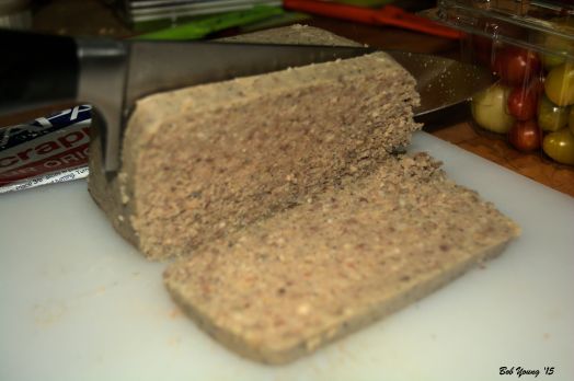 Slice the scrapple with a very sharp knife about 1/4 to 1/2" thick. Work carefully.