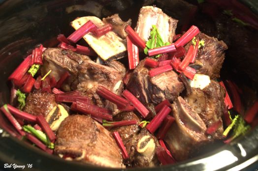 Braised - caramelized - beef short ribs, beet stems and potatoes are waiting for the beet cooking liquid.